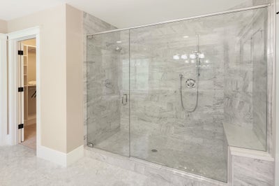 Extra large stone surrounded walk in shower.