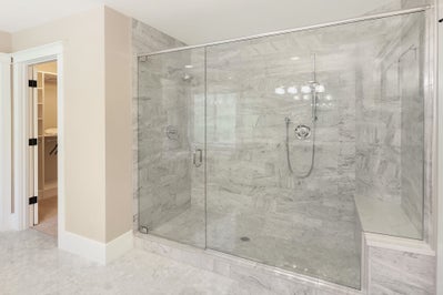 Extra large stone surrounded walk in shower.