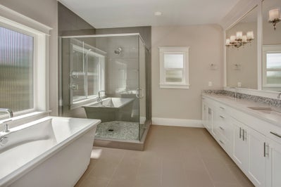Primary bathroom with soaking tub. walk in shower and double sink vanity.