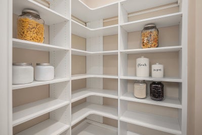 Pantry with white shelving