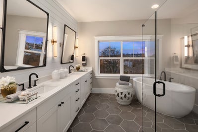 Bathroom with large double sink vanity and soaking tub