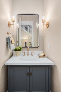 Bathroom vanity with gold finishes