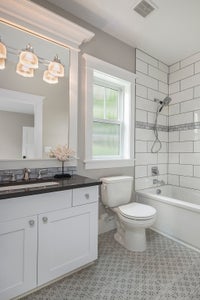 Bathroom with tiled tub.