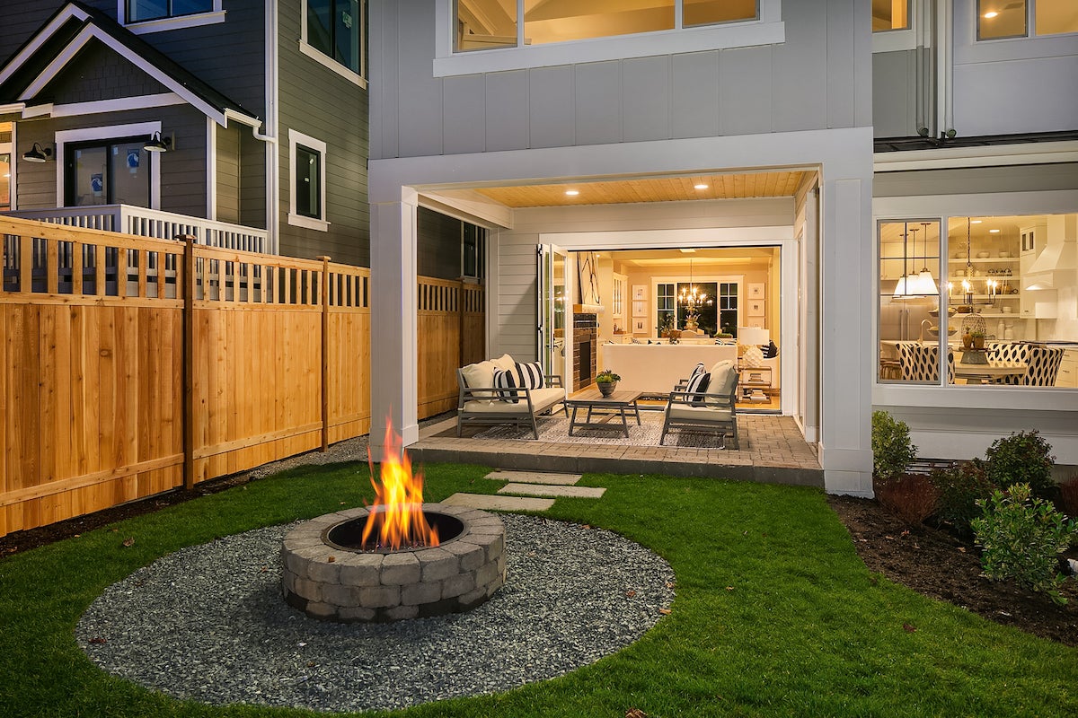 Outdoor space features cover patio and built in fireplace.