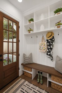 Mudroom with built in coatrack and bench.