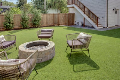 Fire pit built into beautiful landscaped yard.