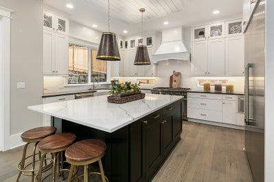 Kitchen with black island cabinets