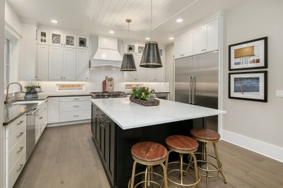 kitchen with white countertops and bar seating