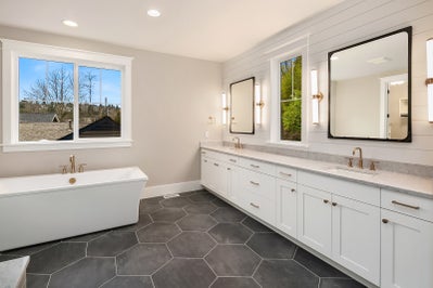 Master suite with soaking tub and large duel sink vanity.