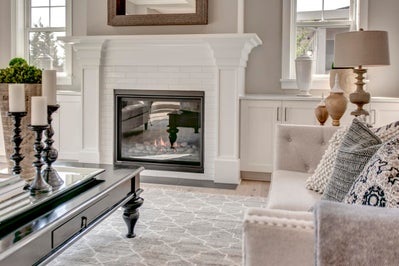 Electric fireplace with white mantle.