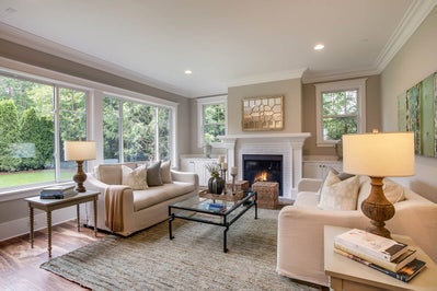 Great room with fireplace and large windows.