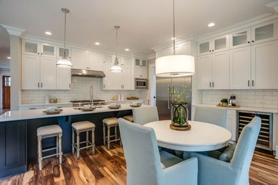 two tone kitchen open to breakfast nook